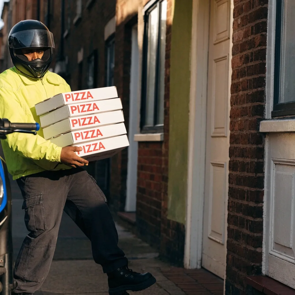 Fireaway pizza in a delivery box on the shop counter